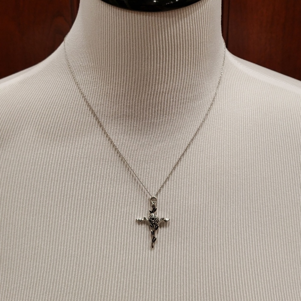Necklace with a delicate cross/pendant.